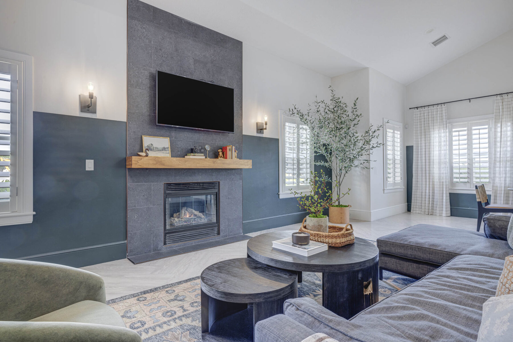 living room area with couches and TV